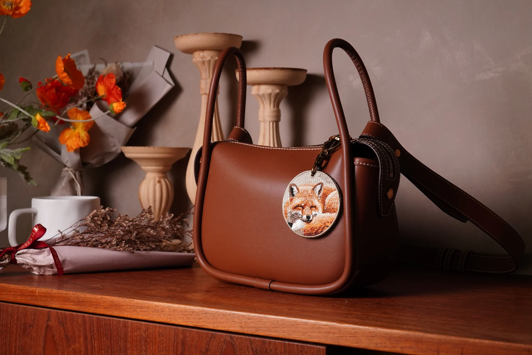 EMJOUR handbag with embroidered accessory