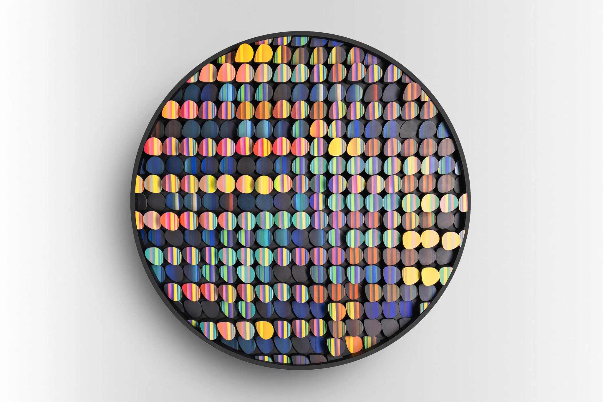 Circular textile artwork with colorful striped elements