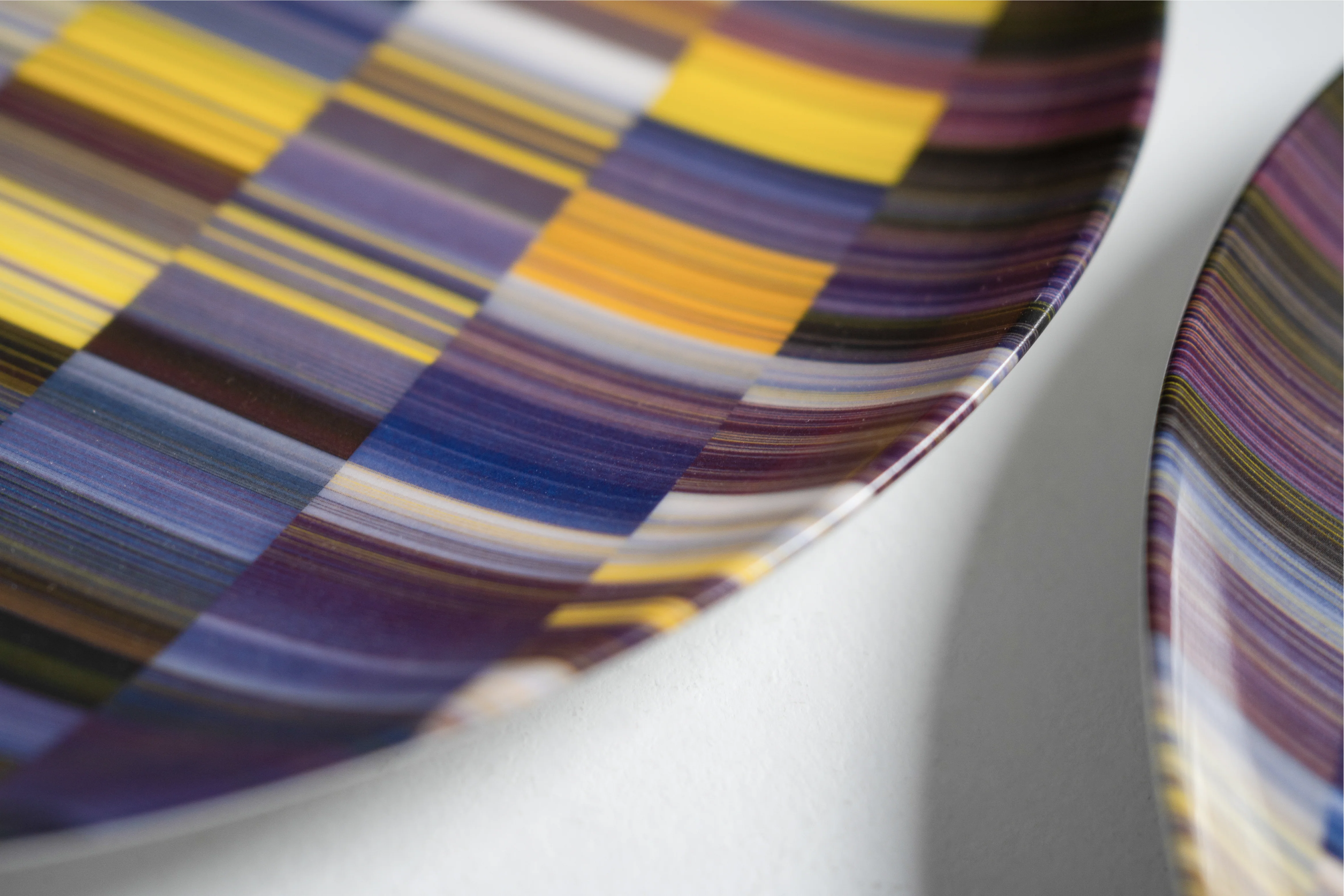 Close-up of a curved object with layered textile pattern