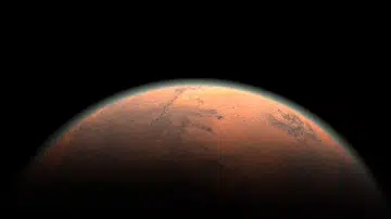 Animated film still showing a glowing planet-like form